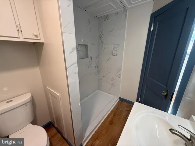 a bathroom with a sink and a large mirror