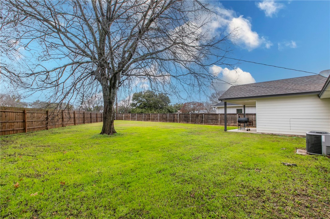 105 Alamo Drive McGregor, TX 76657 - Photo 29 of 34 a view of a backyard with a tree
