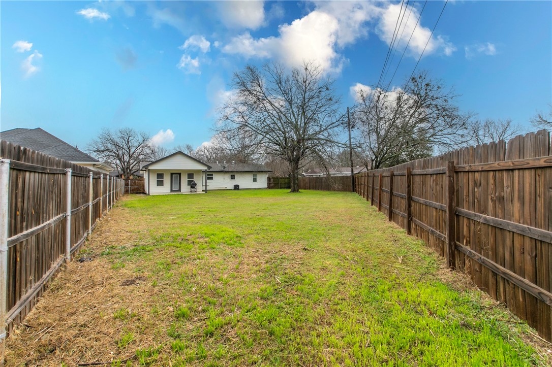 105 Alamo Drive McGregor, TX 76657 - Photo 30 of 34 a view of a house with backyard and tree