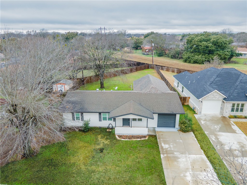 105 Alamo Drive McGregor, TX 76657 - Photo 4 of 34 an aerial view of a house with swimming pool garden and mountain view