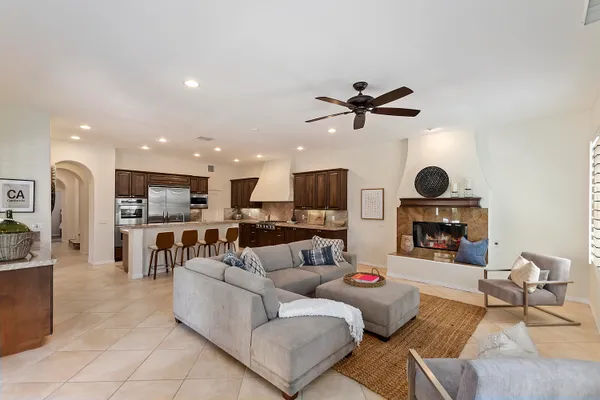 a living room with furniture and kitchen view