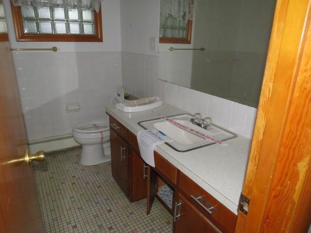 120 Virginia Street Latrobe, PA 15650 - Photo 19 of 31 a bathroom with a sink a toilet and a window