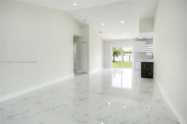 an empty room with fireplace
