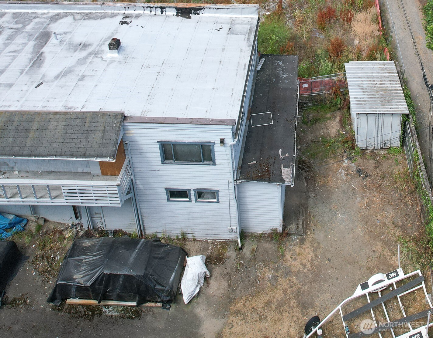 320 Northwest 85th Street Seattle, WA 98117 - Photo 3 of 8 an aerial view of a house with a yard and sitting space
