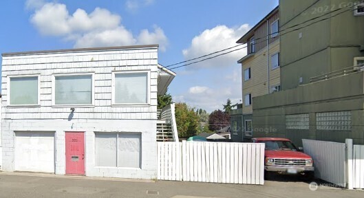 320 Northwest 85th Street Seattle, WA 98117 - Photo 6 of 8 a view of a house with a parking space