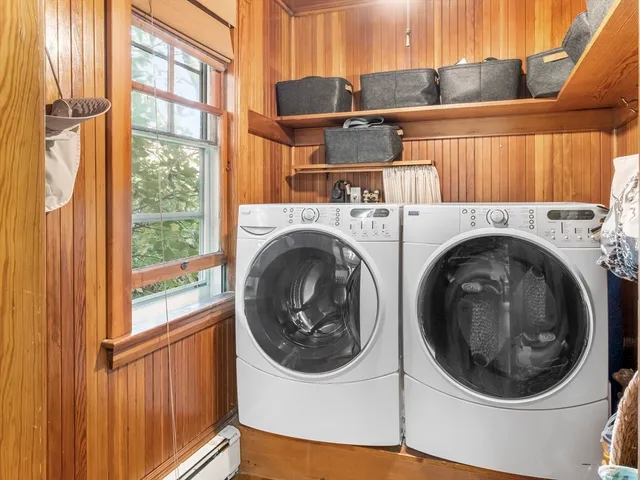 a bathroom with a sink mirror and a toilet