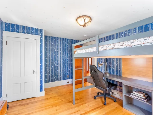 a view of a dining room with furniture and a window