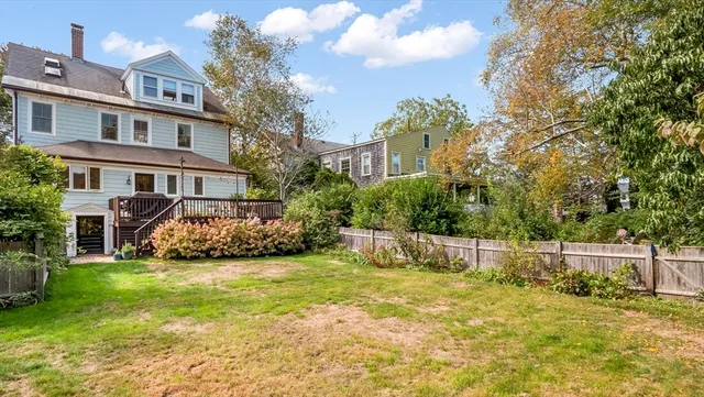a view of a chairs and table in the balcony