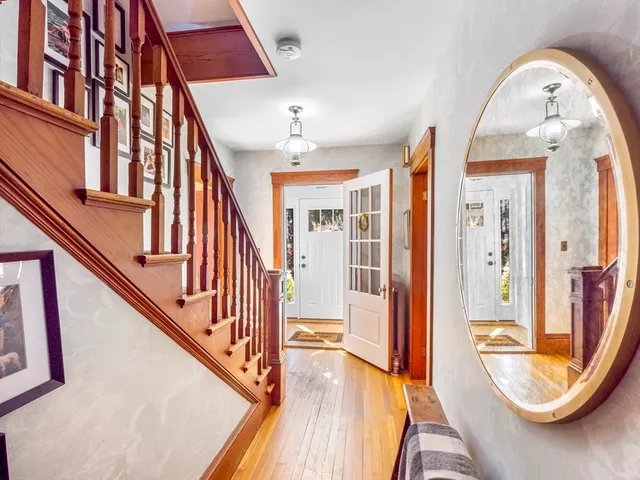 a living room with furniture ceiling fan and a window