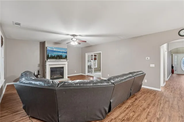 a kitchen with stainless steel appliances granite countertop a refrigerator stove microwave and sink