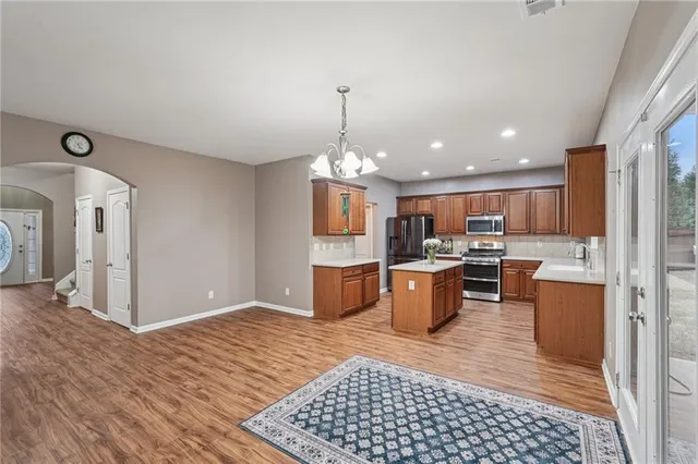 a bedroom with a bed and a table