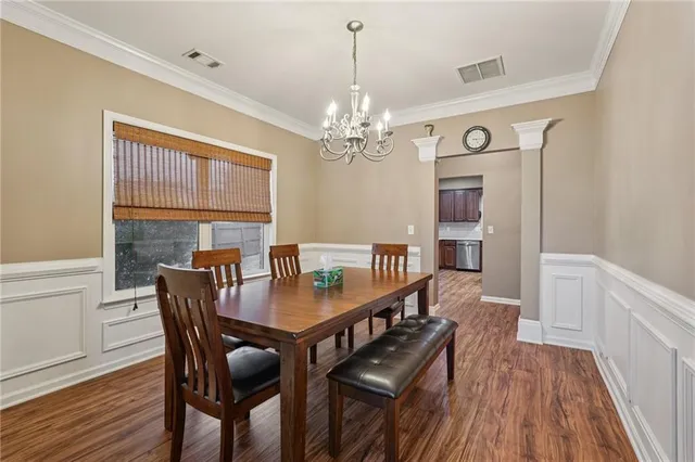a en suite bathroom with a sink a double vanity and a mirror