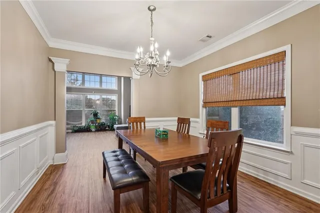 a bathroom with a toilet a sink and a window
