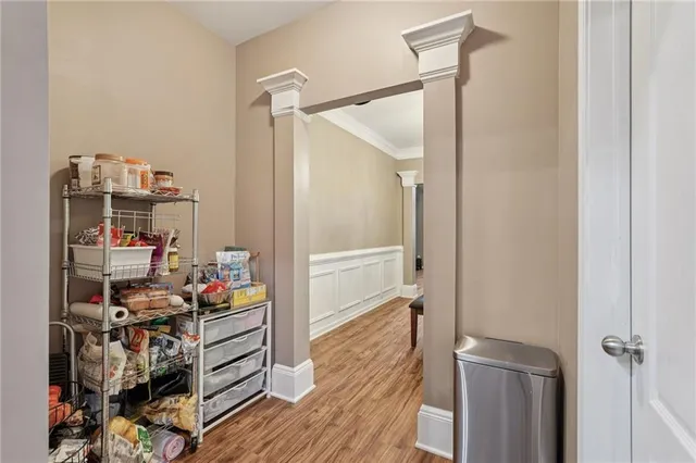 a spacious bedroom with a bed and a chandelier