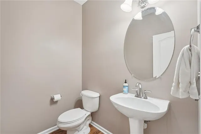 a bathroom with double sink and a mirror