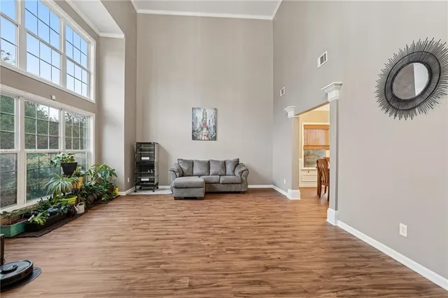 a living room with furniture fireplace and flat screen tv