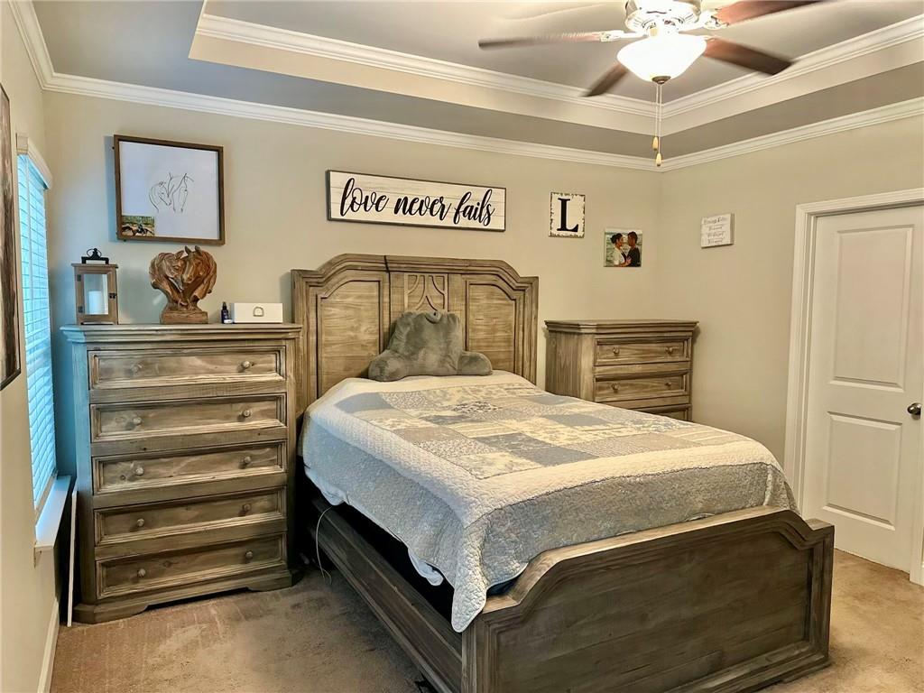 263 Camden Lake Drive Villa Rica, GA 30180 - Photo 11 of 25 a bed sitting in a bedroom and chandelier