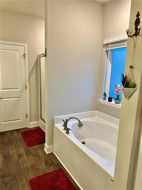 263 Camden Lake Drive Villa Rica, GA 30180 - Photo 14 of 25 a bathroom with a tub and a shower