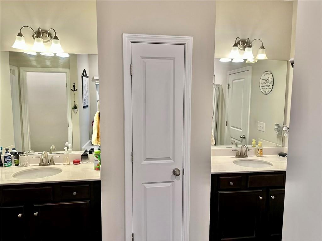 263 Camden Lake Drive Villa Rica, GA 30180 - Photo 15 of 25 a bathroom with a double vanity sink mirror and