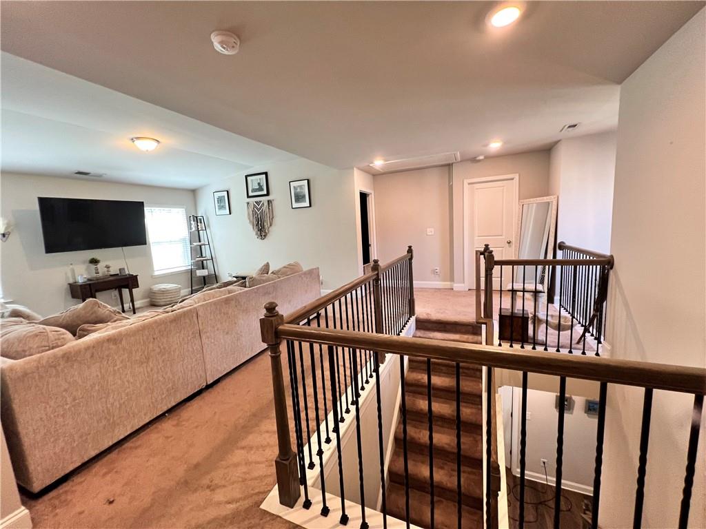 263 Camden Lake Drive Villa Rica, GA 30180 - Photo 17 of 25 a living room with furniture and a flat screen tv