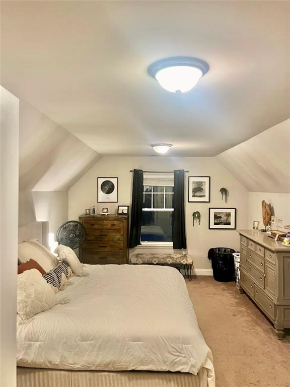 263 Camden Lake Drive Villa Rica, GA 30180 - Photo 21 of 25 a large bedroom with a large bed and wooden floor