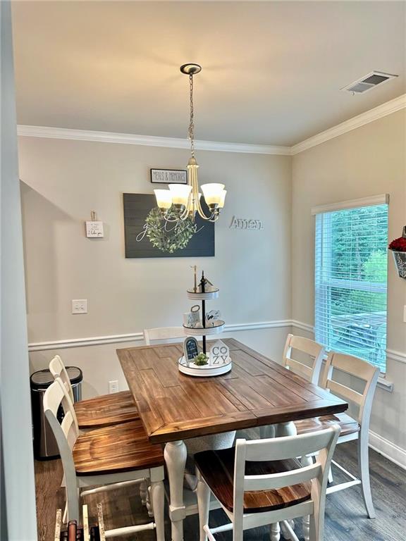 263 Camden Lake Drive Villa Rica, GA 30180 - Photo 8 of 25 a dining room with furniture a chandelier and window