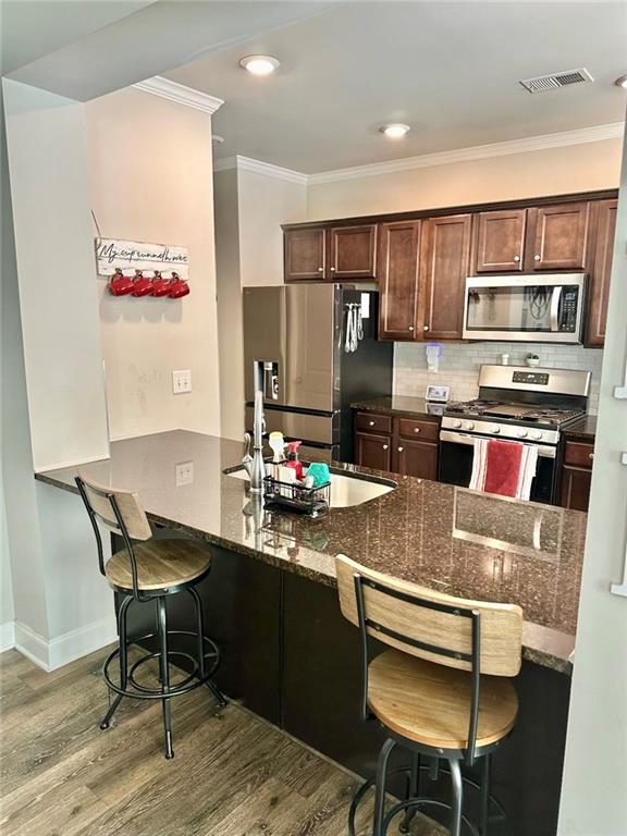 263 Camden Lake Drive Villa Rica, GA 30180 - Photo 9 of 25 a kitchen with stainless steel appliances kitchen island granite countertop a sink and cabinets