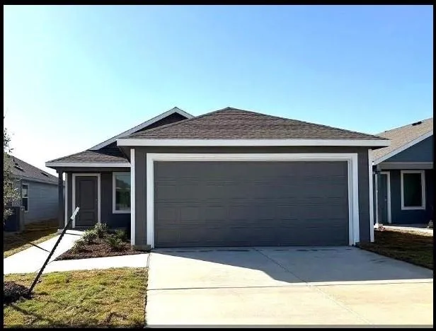 a view of a kitchen with a sink and a window