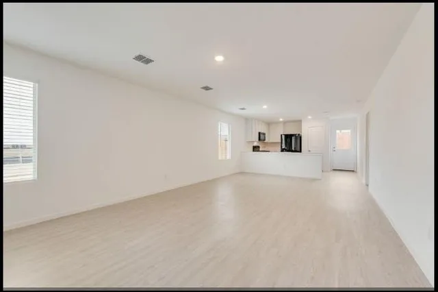 a kitchen with a refrigerator and a sink