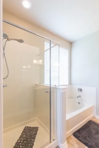 a kitchen with stainless steel appliances kitchen island granite countertop a table and chairs in it