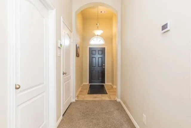 a bench sitting in a room next to a window