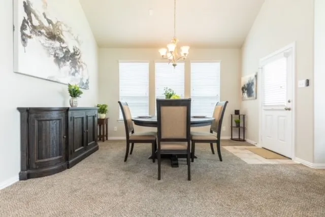 a living room with furniture potted plant and a window