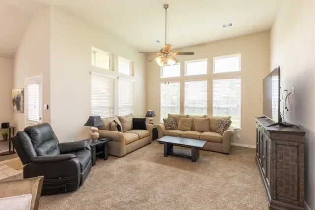 a kitchen with a table and chairs