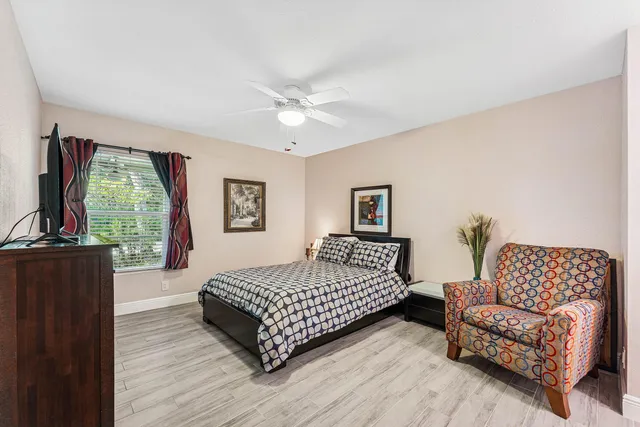 a bedroom with a bed and a couch