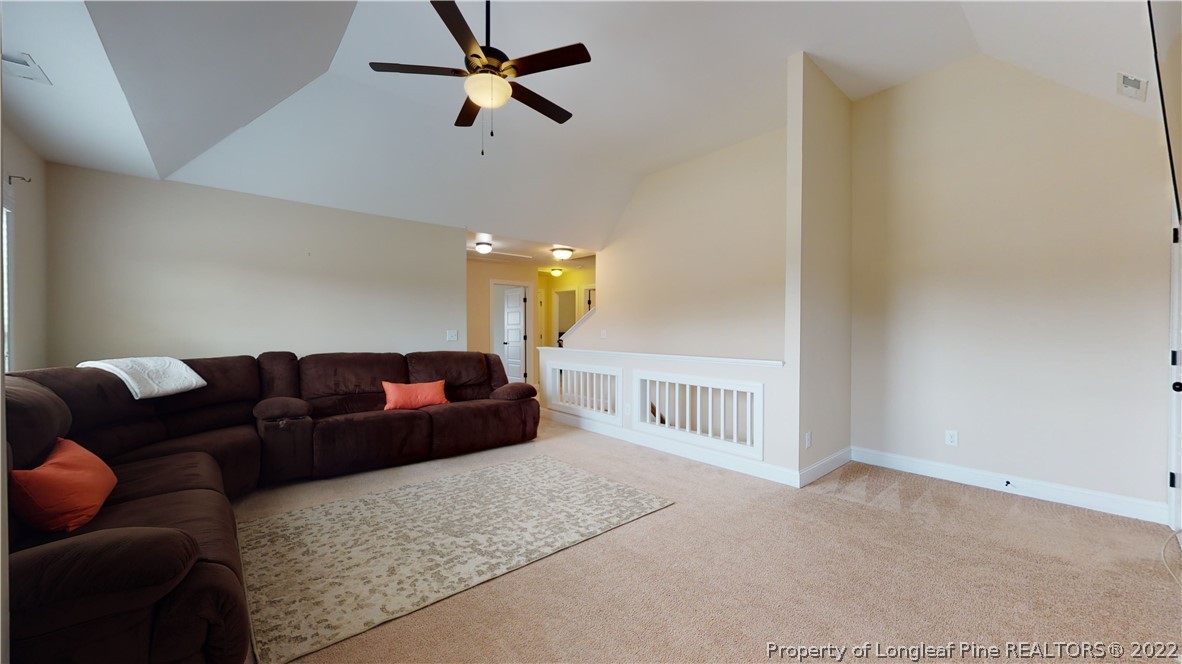 109 Caulfield Road Aberdeen, NC 28315 - Photo 18 of 28 a living room with furniture and a ceiling fan