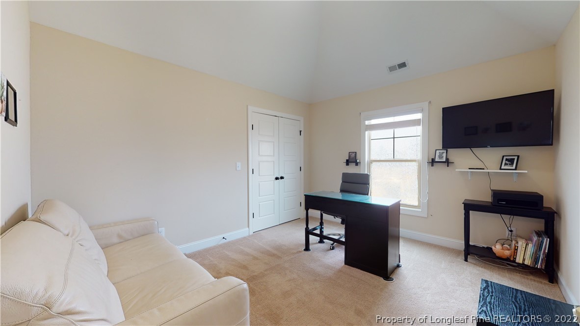 109 Caulfield Road Aberdeen, NC 28315 - Photo 22 of 28 a living room with furniture and a flat screen tv