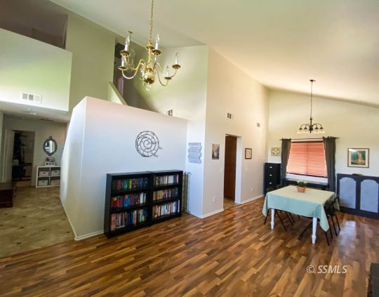 1109 Rebecca Avenue Ridgecrest, CA 93555 - Photo 12 of 50 a view of a room with furniture and wooden floor