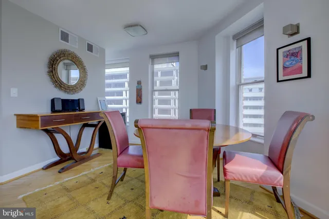 a view of a livingroom with furniture and workspace