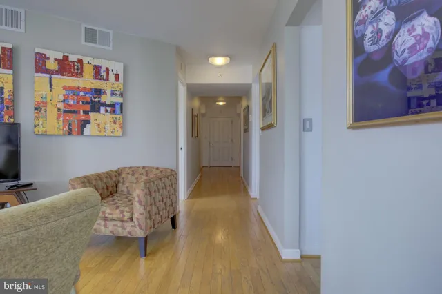a living room with furniture and a rug