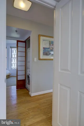 a view of a room with wooden floor and window