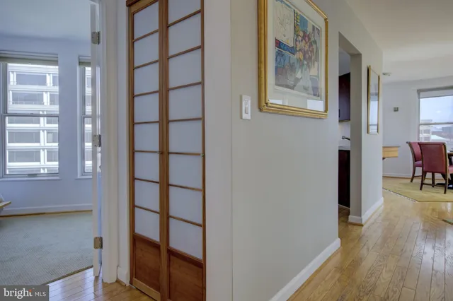 a view of a livingroom with furniture and hardwood floor