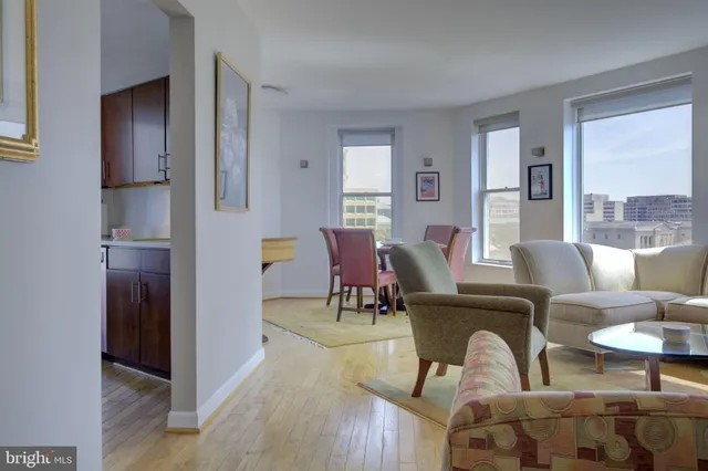 a living room with furniture and a table