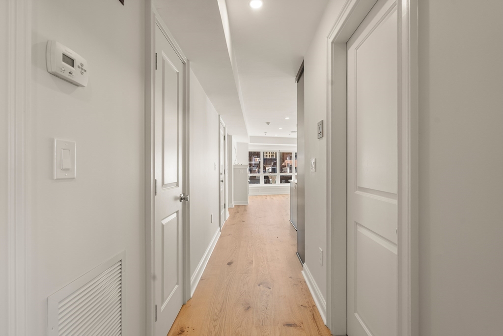 9 North Margin Street Boston, MA 02113 - Photo 11 of 12 a view of a hallway with wooden floor and staircase