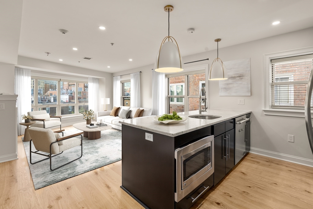 9 North Margin Street Boston, MA 02113 - Photo 3 of 12 a kitchen with a stove and a wooden floor