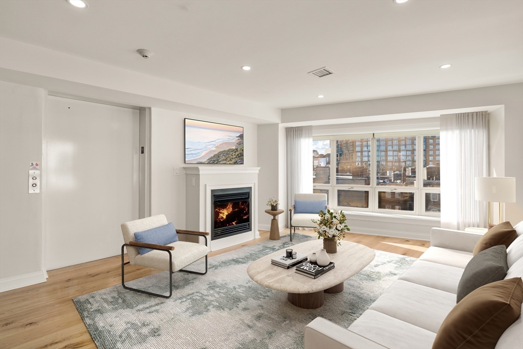 9 North Margin Street Boston, MA 02113 - Photo 4 of 12 a living room with furniture and a fireplace