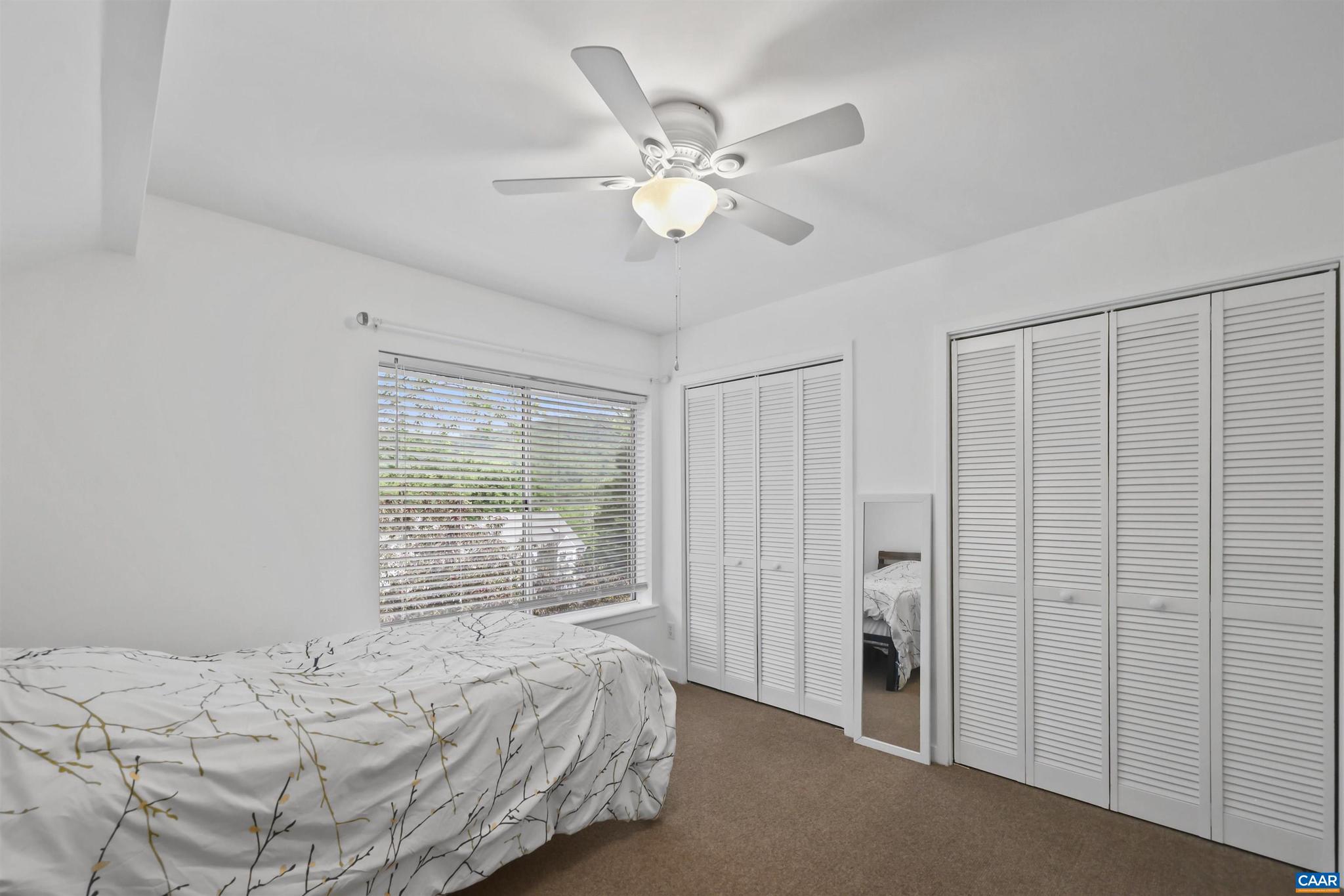 1250 Maple View Drive Charlottesville, VA 22902 - Photo 15 of 25 a bedroom with a large bed and a window