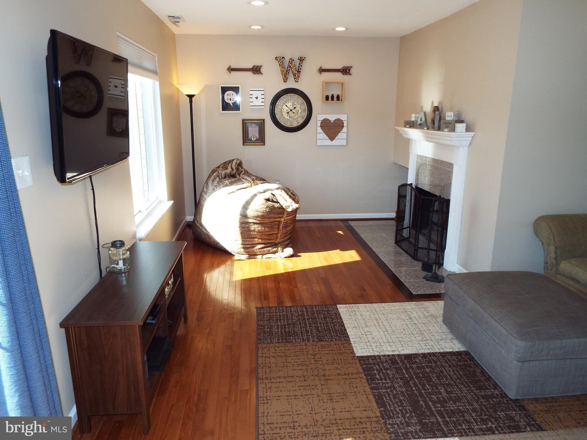 10909 Trotting Ridge Way, Unit 910 Columbia, MD 21044 - Photo 5 of 28 Hardwood Floors Shine, Wood Burning FP