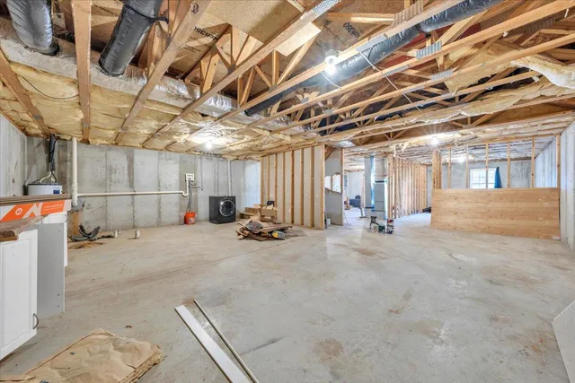 a view of a empty room with wooden ceiling
