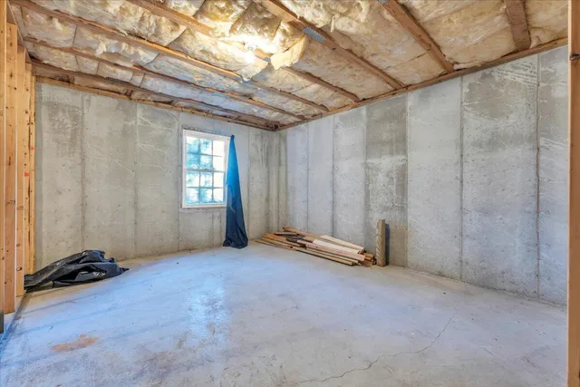 a view of a room with wooden walls
