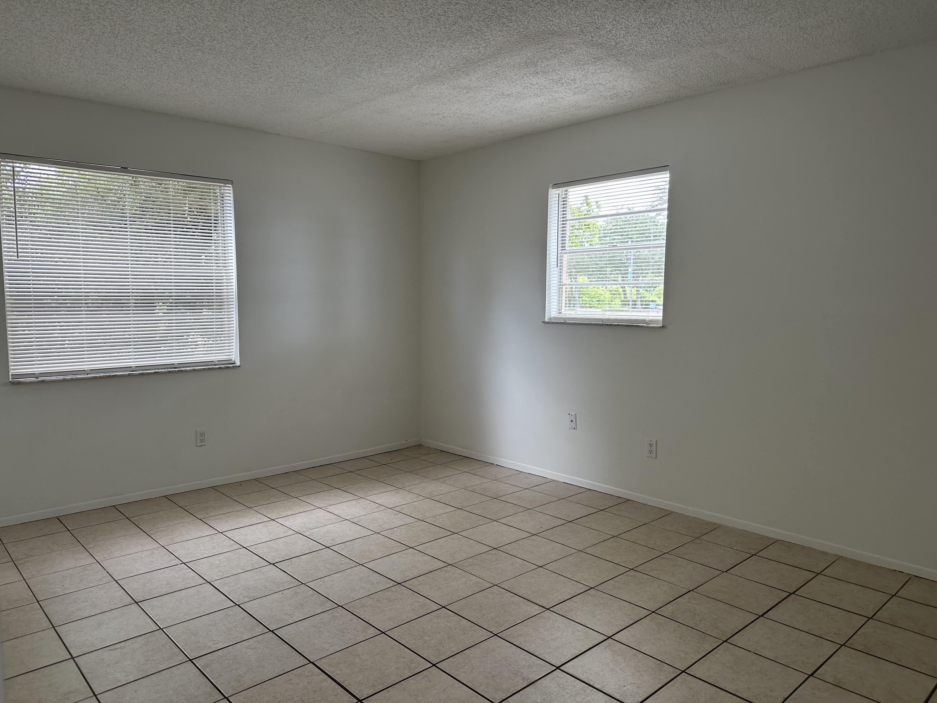 4606 Southeast Binnacle Way, Unit 1 Stuart, FL 34997 - Photo 3 of 5 an empty room with a window